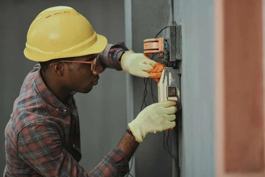 Appliance repair technician testing electronics with specialized tools
